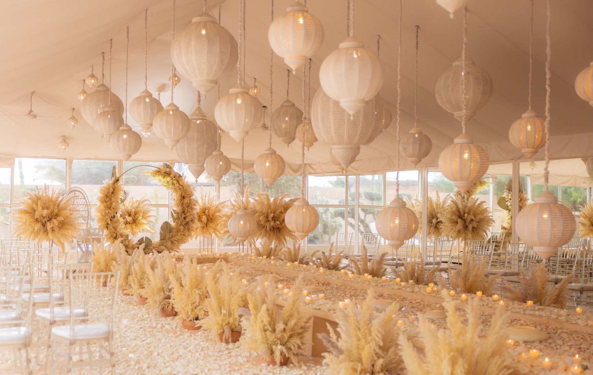 Wider view of the sheltered wedding ceremony under Moroccan lanterns